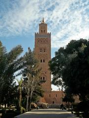 street in Marrakesh, Morocco with palm trees and traditional architecture