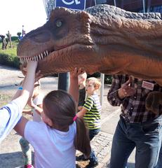 dinosaur costume attraction at the Museum of Evolution booth