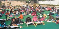 Children participate in a drawing and painting competition organized by the National Rail Museum in New Delhi