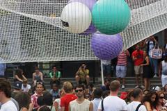 people hanging out under hanging balls at PS1 Summer Warm Up 2010