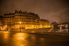 lone figure walking on a Paris street in the morning