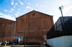 Hamada red brick building riddled with bullet holes