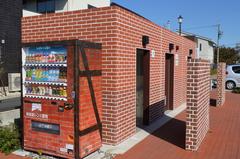 public restroom and vending machines in Handa Red Brick Building parking lot