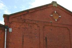 Handa Red Brick Building North Side with Bullet Holes