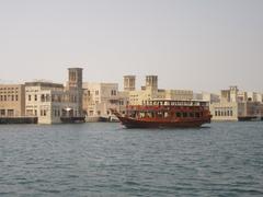 Dubai Al Seef Dhow Cruise on the water at sunset