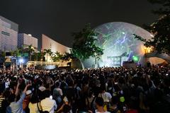 People holding laser pens during a protest in Hong Kong at night