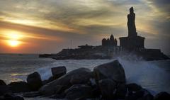 Indian Temple at dusk with Thiruvalluvar Statue