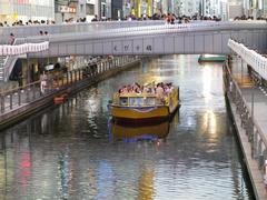 Dotonbori canal at night with illuminated billboards in Osaka, Japan