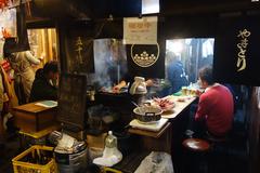 Omoide Yokocho alley in Tokyo's Shinjuku district with warming lights