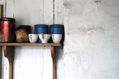 Traditional ceramic cups displayed at Frilandsmuseet