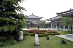 traditional Chinese building with a tiled roof and intricate wooden carvings