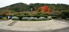 Scenic view of Togokusan Fruit Park with autumn foliage, lake, and mountains