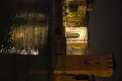 Verona at night during Christmas with Arco Gavi and river Adige