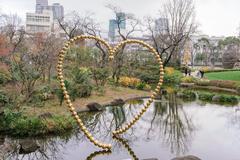 Mori Park garden with tranquil pond and surrounding greenery in Tokyo