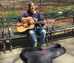 Busker singing 'Imagine' at Strawberry Fields in Central Park