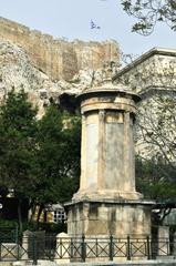 Monument to Lysicrates in Athens with Acropolis wall in the background