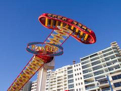 Luna Park Sydney with its iconic entrance and amusement rides