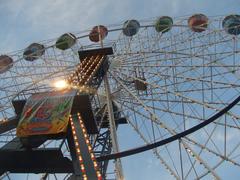 Ferris Wheel at sunset with colorful cabins