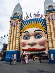 Guide dog with two clowns at Luna Park in Milsons Point, Sydney