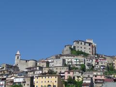 A scenic view of Ceccano, an Italian town with historical architecture and lush greenery