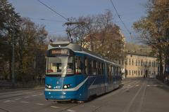 Street scene from Kraków's Old Town area showing EU8N HL437 tram on line 1