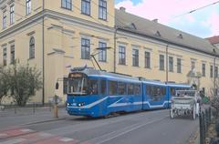 Street view of Kraków's Old Town featuring Franciszkańska Street with EU8N tram number 78