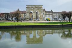 Arch of Germanicus reflecting in the Charente River