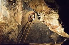 cave interior with rock formations and artificial lighting