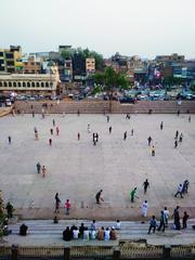 Boys playing cricket with tape ball in Cobbler's Garden, Lahore