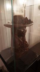 Chocolate sculpture of a young woman in a flowered hat