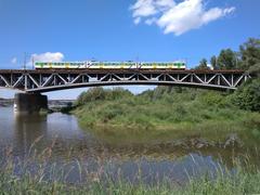 Train crossing the Średnicowy Bridge in Warsaw viewed from the right bank of the Vistula River