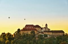 Špilberk Castle at sunset with flying balloons in Brno