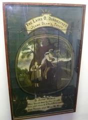 Old tavern sign depicting Jeanie Deans and the Laird o' Dumbiedykes