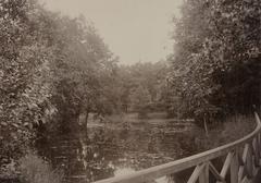 South end of a long pond in the Eläintarha area on the Alppila side, where the current Tivolitie road passes under railway; black and white, mounted drawing