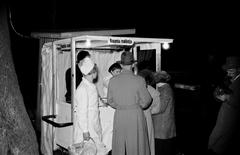 People celebrating at Vapputanssit Alppilavalla near a snack kiosk