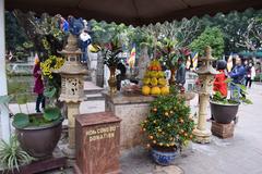 Colorful offerings with flowers, fruits and incense sticks