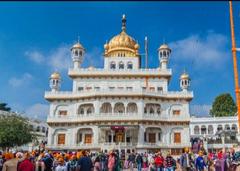 Takht Sahib at sunset with golden domes