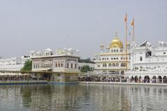 Golden Temple in Amritsar, India illuminated at night with its reflection in the surrounding water