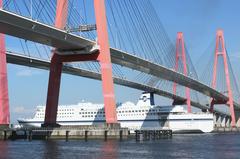 Pacific Ferry Ishikari passing under Meiko West Bridge