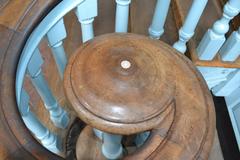 Volute with inlaid ivory button on walnut handrail inside Independence Hall