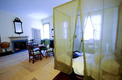 Bishop White's bedroom with four-poster bed and mosquito netting