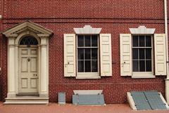 Bishop White House exterior with white front door and first floor windows with white shutters