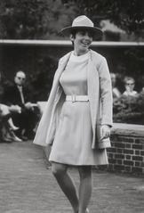 Carole Scanlon modeling the 1970 belted dress and matching jacket with broad-brimmed hat