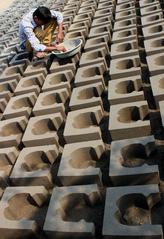 Labor at work with abstract blocks in Vadodara, Gujarat