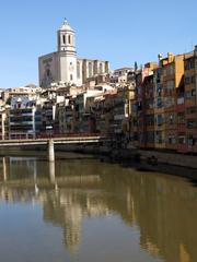 façade along the river Onyar in Girona with bridges and Cathedral of Girona in view