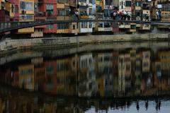 Colorful riverside buildings along the Onyar River in Girona, Spain