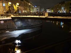 Bank bridge over Griboedov Canal at night during winter in Saint Petersburg, Russia