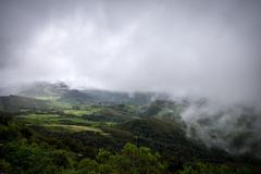 Clouds converging over the meandering paths of Eravikulam National Park