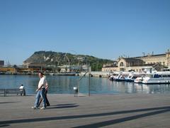 panoramic view of Barcelona cityscape with Sagrada Familia and Mediterranean Sea in the background