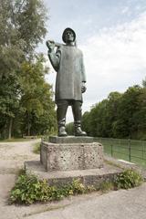 a bronze sculpture of an Isar-Raftsman at Hinterbrühler See in Munich, Germany